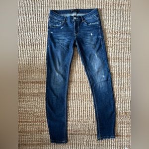 Zara mid-rise ripped skinny jeans.